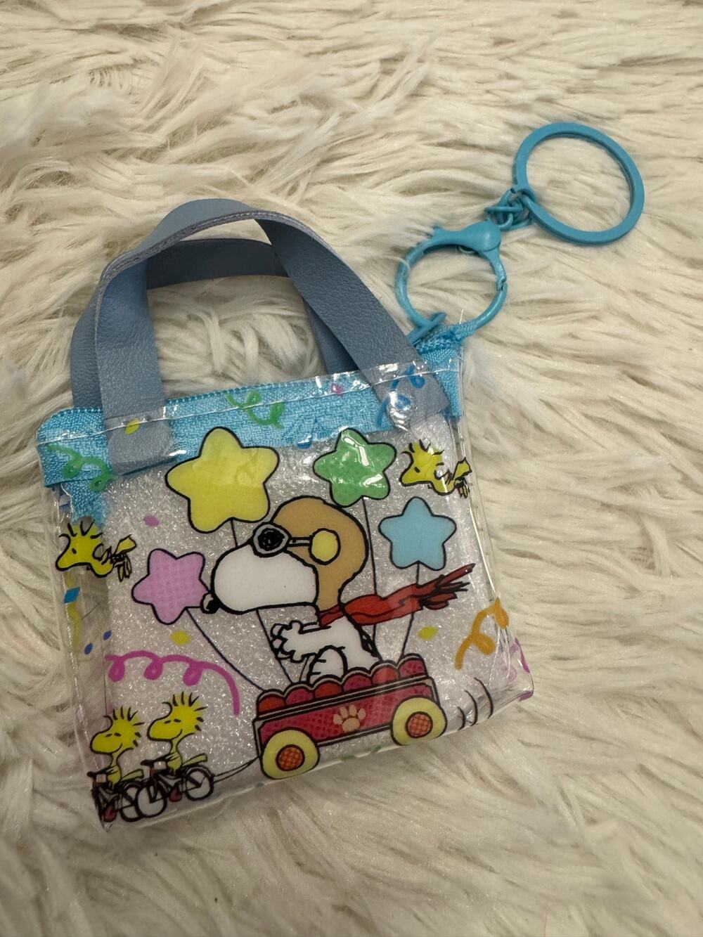Snoopy small clear tote bag keychain Snoopy in a red wagon with stars and birds